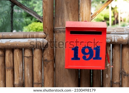 Red box , Police check point box, 191 police box on bamboo wall, post box hang on bamboo wall background.