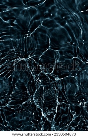 Black water with ripples on the surface. Defocus blurred transparent blue colored clear calm water surface texture with splashes and bubbles. Water waves with shining pattern texture background. Royalty-Free Stock Photo #2330504893
