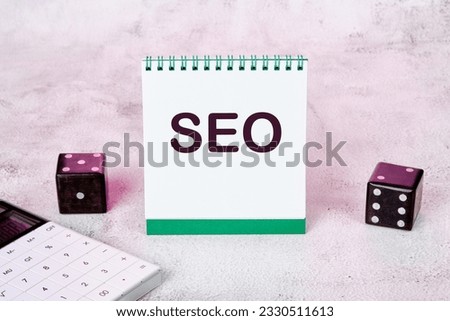 Seo text on a notepad standing on the table is an open Notebook With An Seo Optimization Scheme. Search Engine Optimization Of Web Content, The Concept Of Internet Business Development.
