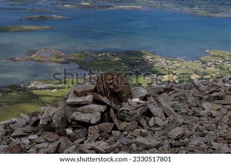 St Patrick plaque overlooking Clew Bay atop of Croagh Patrick Royalty-Free Stock Photo #2330517801