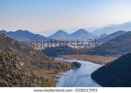Scenic view from Pavlova Strana on horseshoe bend of river Crnojevica winding around Dinaric Alps mountains in Lake Skadar National Park, Bar, Montenegro, Balkans, Europe. Natural hilly landscape Royalty-Free Stock Photo #2330517993