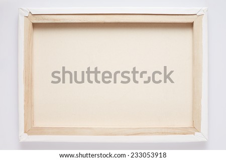 Canvas back on stretcher on white wall, clipping path