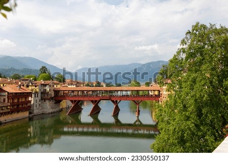 The Old Bridge also called the Bassano Bridge or Bridge of the Alpini, located in the city of Bassano del Grappa in the Province of Vicenza, is considered one of the most picturesque bridges in Italy. Royalty-Free Stock Photo #2330550137