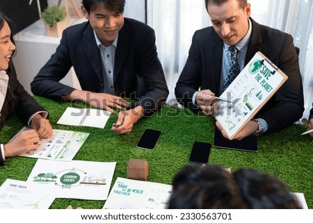Diverse group of business people planning business marketing with environmental responsibility for greener ecology. Productive teamwork contribute natural preservation and sustainable future. Quaint Royalty-Free Stock Photo #2330563701