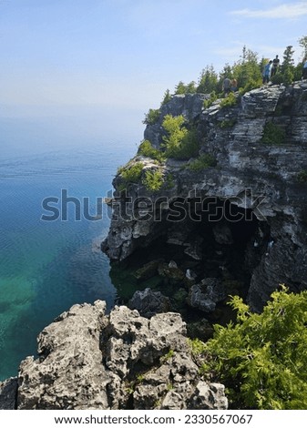 Bruce Peninsula National Park Huron Lake Georgian Bay Clear Turquoise Blue Water Sky Rocks Cliff Grotto Ontario Canada famous popular turist travel place landscape 
