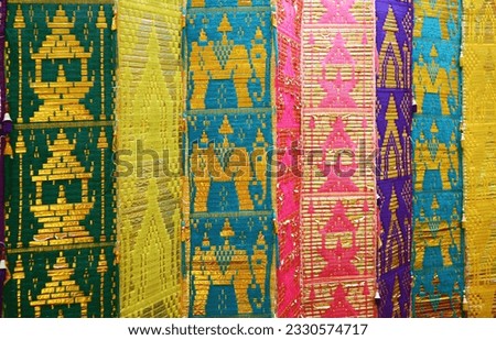 Multi-colored Traditional Long Flag or Toong in Buddhist Temple of Thailand Northern Region
