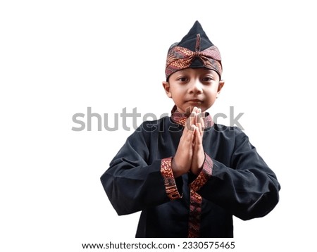 Asian boys wear traditional Sundanese clothes namely "pangsi" and "iket" at cultural events with hand greetings,
The Sundanese are a tribe in the western part of the island of Java