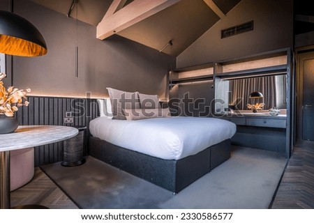 Stylised contemporary boutique hotel room and suite Royalty-Free Stock Photo #2330586577