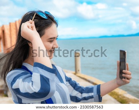 Summer vacations. Smile asian young adult woman use smart phone selfie for social network connect. Travel summer vacations, copy space for banner