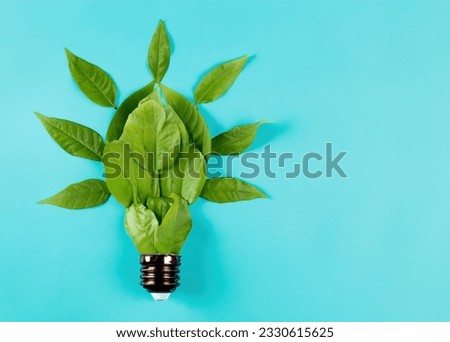 Fresh Leaves Shaped as a Green Lightbulb - Organic Growth and Eco-Consciousness - Symbolic Representation of Green Energy.