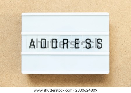 Lightbox with word address on wood background