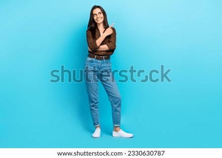 Full length portrait of attractive girl direct finger look interested empty copy space wear casual outfit isolated blue color background