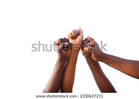 Four fists of African people united in sky, photo with white background and copy space.
