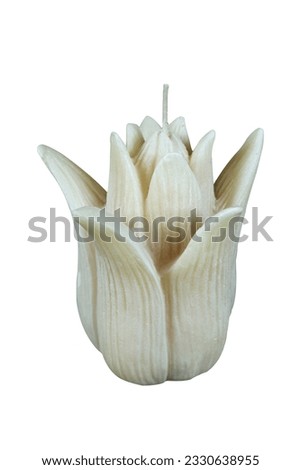 Candle in the shape of a white lotus flower, pictured from the front and isolated
