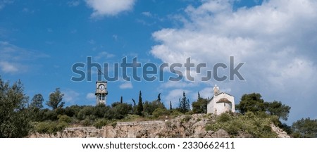 Elefsina Panagia Mesosporitissa old Orthodox Chapel, Belfry and Clocktower on rock over Archaeological Site, destination Attica Greece. Banner