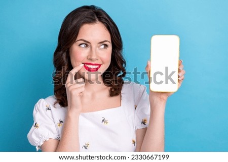 Photo portrait of lovely young lady hold gadget eshopping white touchscreen dressed stylish blue garment isolated on pink color background