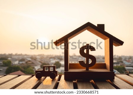 Car and house model in wood table, concepts of contract to buy, get insurance or loan real estate or property background.