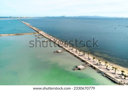 Drone point of view, panoramic shot  seafront of San Pedro del Pinatar, touristic heart of the Costa Calida. This small seaside town is famous for its therapeutic mud baths and salt flats. Spain Royalty-Free Stock Photo #2330670779