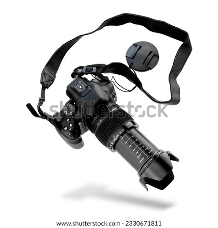levitating or falling mirrorless camera isolated on white background. Black photo camera with big zoom.