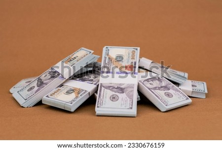 Many dollars stacked together Earnings from work, salaries, investments, financial loans, mutual funds, banknotes, dollars