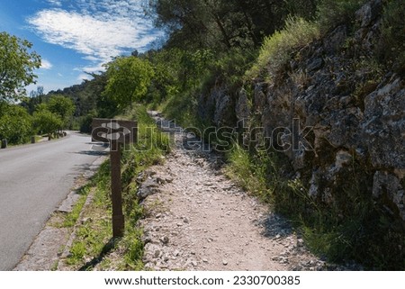 feet on the sign indicate the hiking trail , in national park krka in croatia