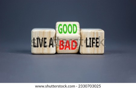 Live good life symbol. Concept word Live a good or bad life on wooden block on a beautiful grey table grey background. Business live a good or bad life concept. Copy space.