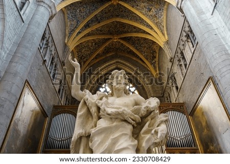 Capture the beauty of John the Baptist statue in Liège Cathedral, Belgium - a serene masterpiece. Royalty-Free Stock Photo #2330708429