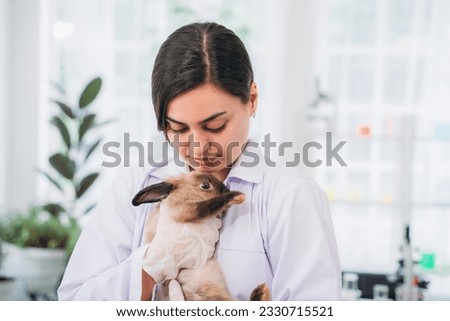 Scientist and Pharmacist Conducting Chemical Research and Animal Testing in a Laboratory. Rabbit in Laboratory Experiments. Ethical Pharmaceutical Research.