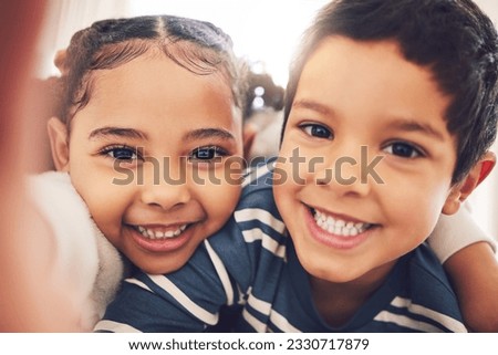 Kids, brother and sister with selfie, portrait and smile in home with hug, care and bonding together. Happy sibling children, photography and profile picture for social media, blog or memory in house