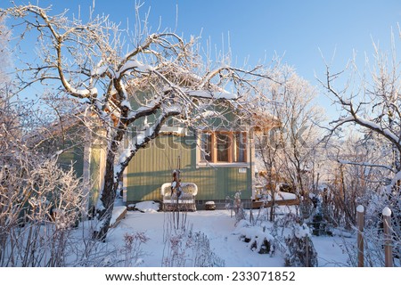 Summer cabin at winter Royalty-Free Stock Photo #233071852
