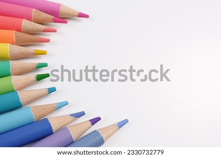 School background with colored pencils of delicate tones.The concept of products for creativity, artists, architects.Back to school.Copyspace Royalty-Free Stock Photo #2330732779
