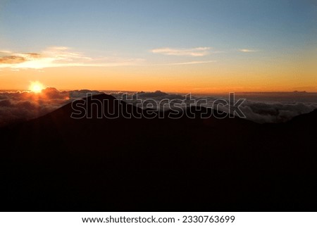Shot of sunrise in Haleakala National Park in Maui, Hawaii. Royalty-Free Stock Photo #2330763699