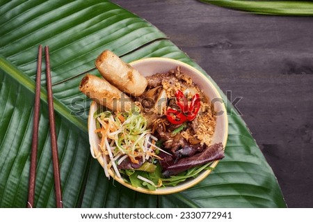 Pan-Asian dish setup on the dark table Royalty-Free Stock Photo #2330772941