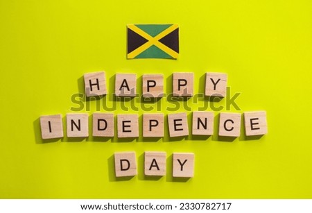On August 6, Jamaica Independence Day, a minimalistic banner with the inscription in wooden letters "happy Independence Day"