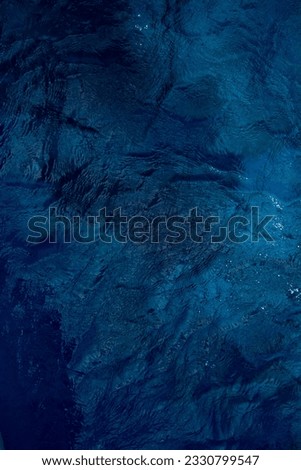 Dark blue ocean surface texture background