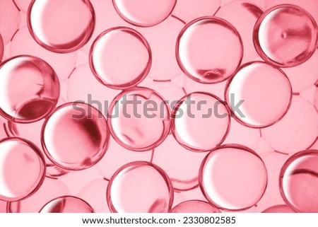 Cream gel drops red transparent cosmetic sample texture with bubbles on pink background