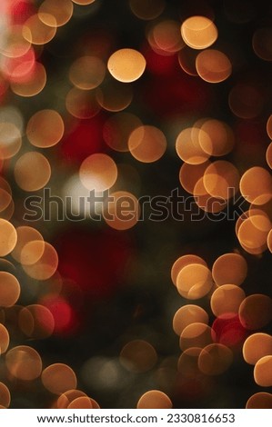 A warm Christmas bokeh background from the lights on a tree.