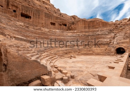 The ancient remains of the first century AD Nabataean theatre in the desert Rose City of Petra Jordan. Royalty-Free Stock Photo #2330830393