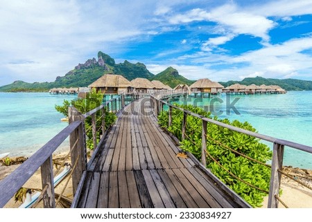 Overwater bungalows in Bora Bora, French Polynesia; tropical paradise Royalty-Free Stock Photo #2330834927