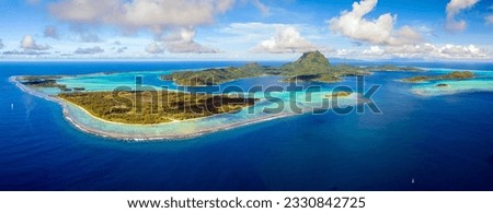 Aerial panoramic view of Bora Bora, French Polynesia and its famous lagoon located in the South Pacific Ocean Royalty-Free Stock Photo #2330842725