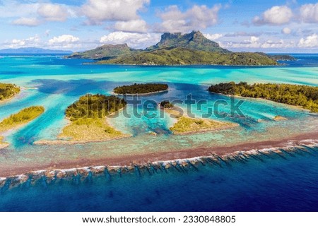 Aerial view of Bora Bora and it multi-colored lagoon in French Polynesia, south pacific ocean Royalty-Free Stock Photo #2330848805