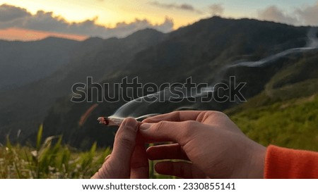 Passing cannabis to friends tired after Royalty-Free Stock Photo #2330855141