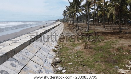 the wave barrier how to resist waves and beach abrasion. wave barrier concrete in the form of a beach box Royalty-Free Stock Photo #2330858795