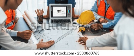 Engineer and architect working together brainstorming and designing blueprint using laptop working with architectural software for precise digital interior or structure design. Insight Royalty-Free Stock Photo #2330860763