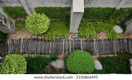Top views of A row of wooden walkways in the garden with natural background at Thailand. Royalty-Free Stock Photo #2330866495