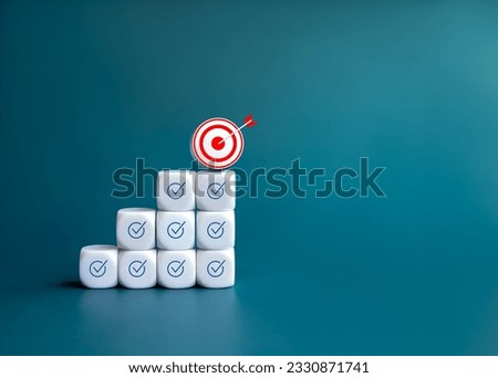 Business goal and success. 3d Target icon on the top of growth graph steps, white blocks with check mark symbol on blue background with copy space. Right procedure management, leadership concept.