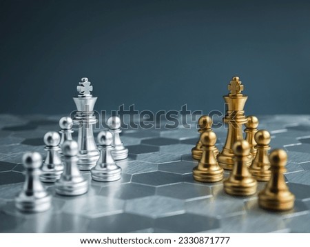 Team of luxury golden and silver chess pieces with king and pawn standing on hexagon pattern floor background. Competition, game, war, partnership, versus, encounter, confront and planning concepts. Royalty-Free Stock Photo #2330871777