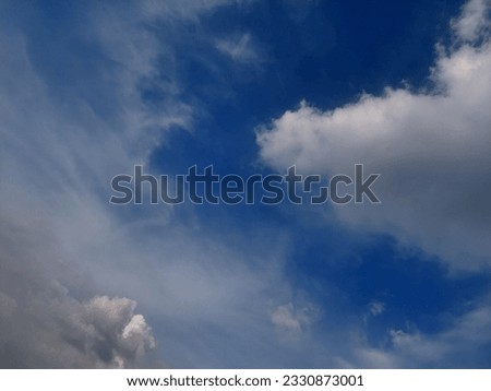 White Clouds in a Blue Sky in Summer - stock photo
