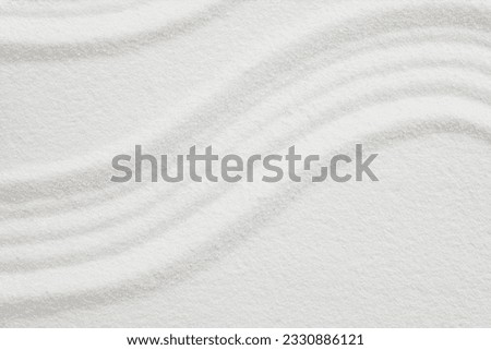 Zen garden with line pattern on white sand in Japanese style, Sand texture surface with wave parallel lines pattern,Background banner for Harmony,Meditation,Zen like concept