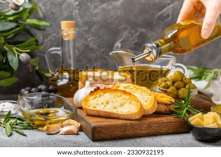 Bruschetta with olive oil, olives, pesto, garlic and parmesan. ciabatta bread with olive oil and spices. Delicacy. Delicious and healthy food. Vegan. Place to copy. copy space. Royalty-Free Stock Photo #2330932195